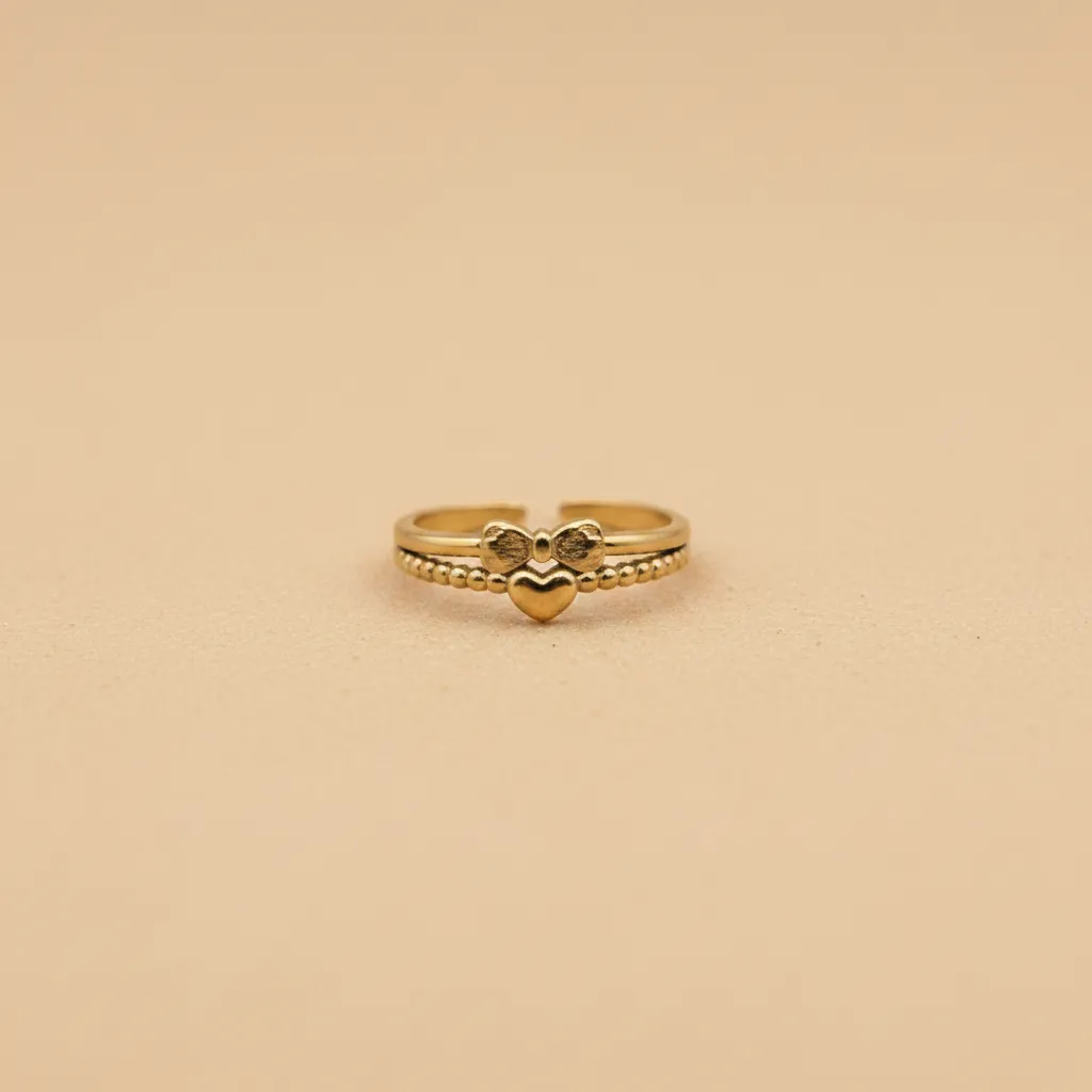 Bague ajustable nœud papillon cœur doré